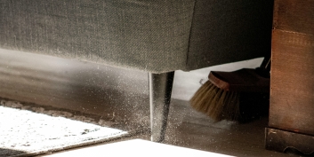 Cleaning under the sofa