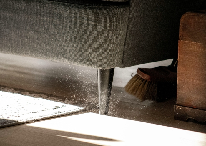 Cleaning under the sofa